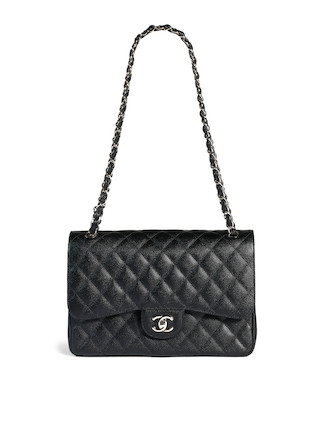 A Classic Chanel Jumbo Flap Bag. Black quilted caviar le…