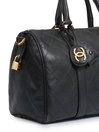 Bonhams : Chanel BLACK QUILTED LAMBSKIN TRAVEL BAG With Gold Tone