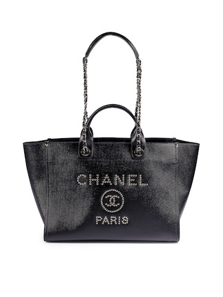 Bonhams : CHANEL BLACK CALFSKIN DEAUVILLE MEDIUM LEATHER TOTE BAG WITH SILVER  TONED STUDDED CC LOGO AND CHAINS (Includes original dust bag)