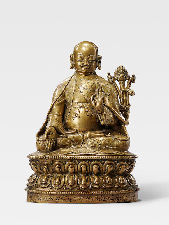 Bonhams : A SILVER INLAID BRASS FIGURE OF THE THIRD SAKYA THRONE HOLDER ...