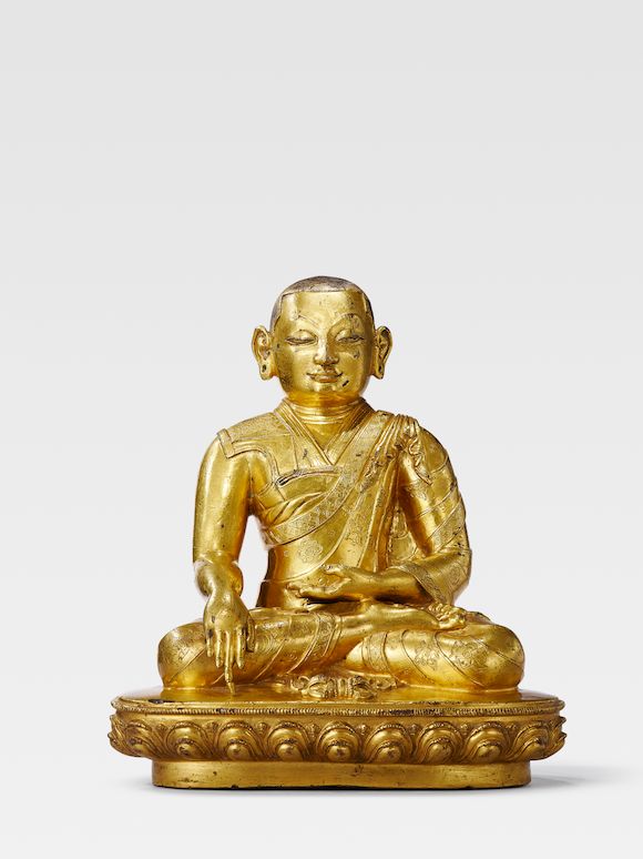 Bonhams A GILT COPPER ALLOY FIGURE OF THE SIXTH ABBOT OF DRIGUNG