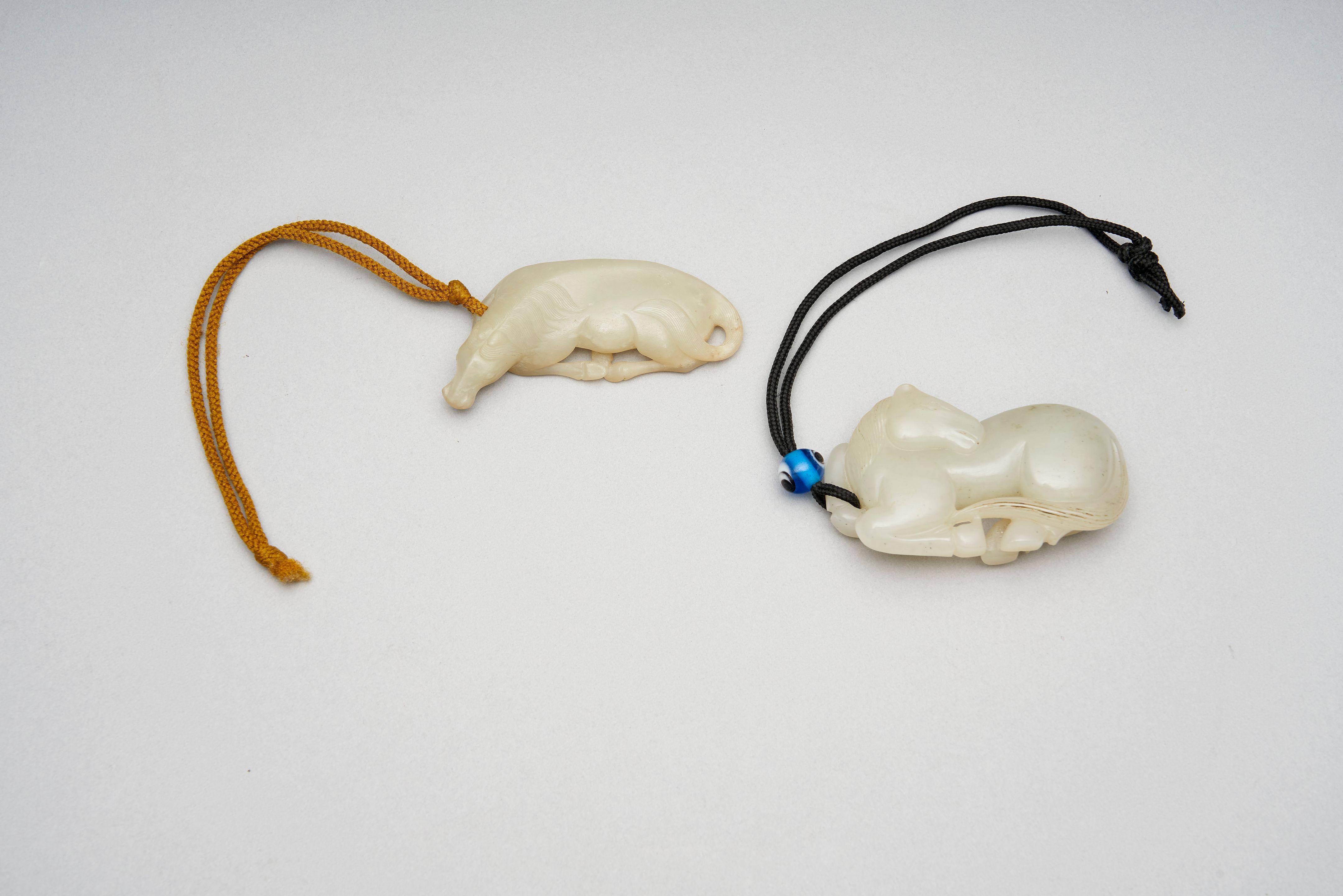 Two celadon jade 'horse' carvings auctions & price archive