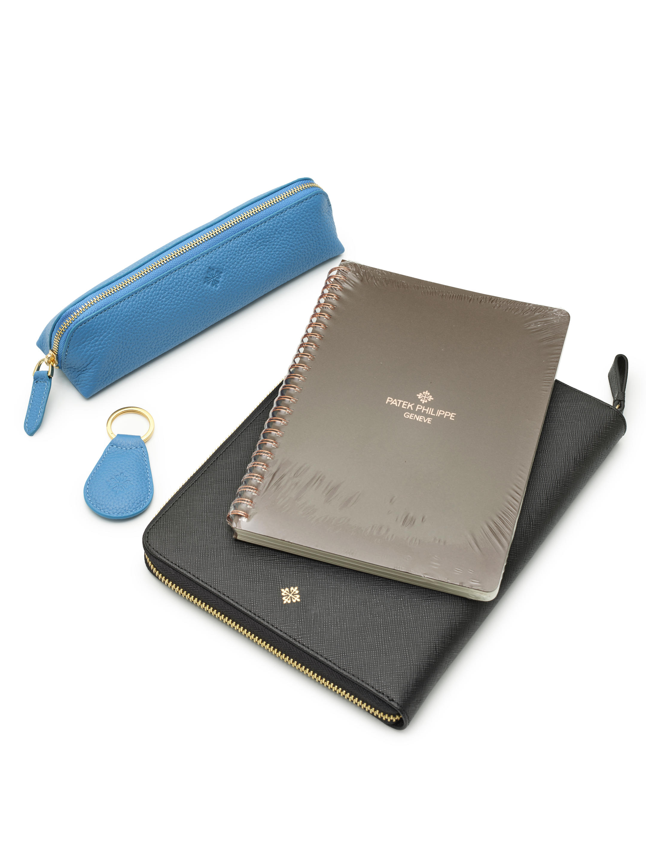 Patek Philippe, Two Pairs Of Gloves, Pen Holder, Notepad And