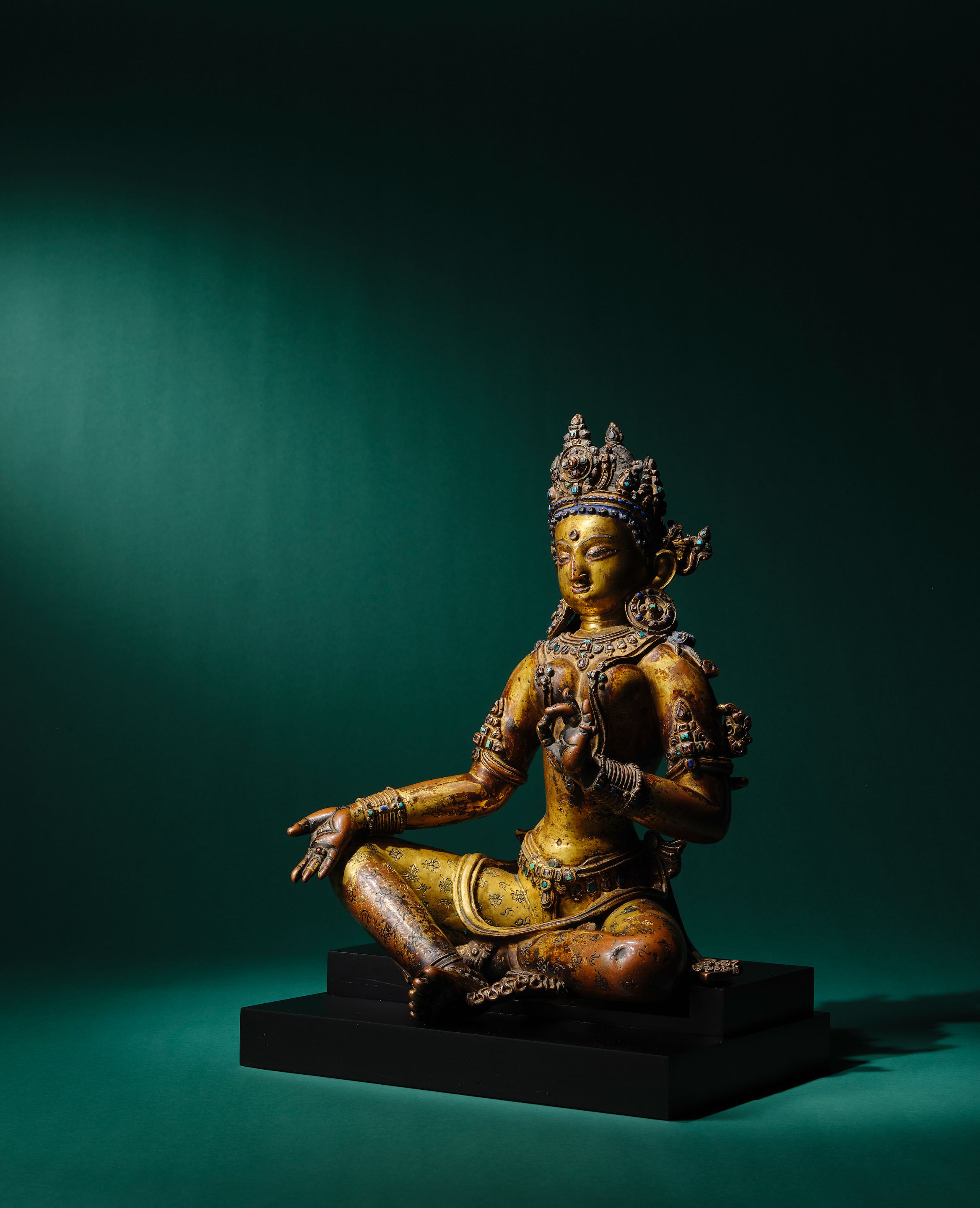 Bonhams A GILT COPPER ALLOY FIGURE OF TARA NEPAL, EARLY MALLA PERIOD