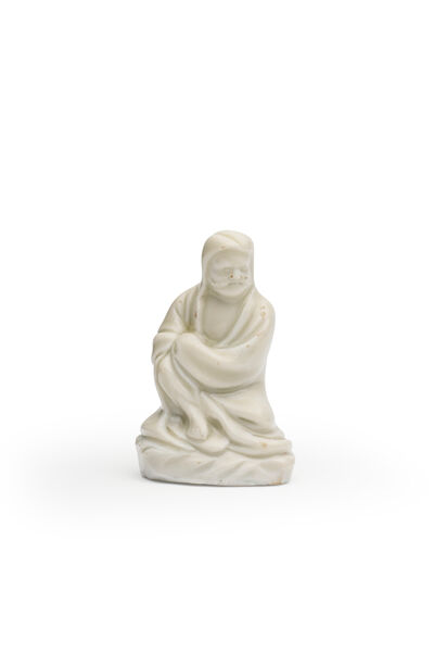 A DEHUA BLANC-DE-CHINE FIGURE OF AN ARHAT 17th century