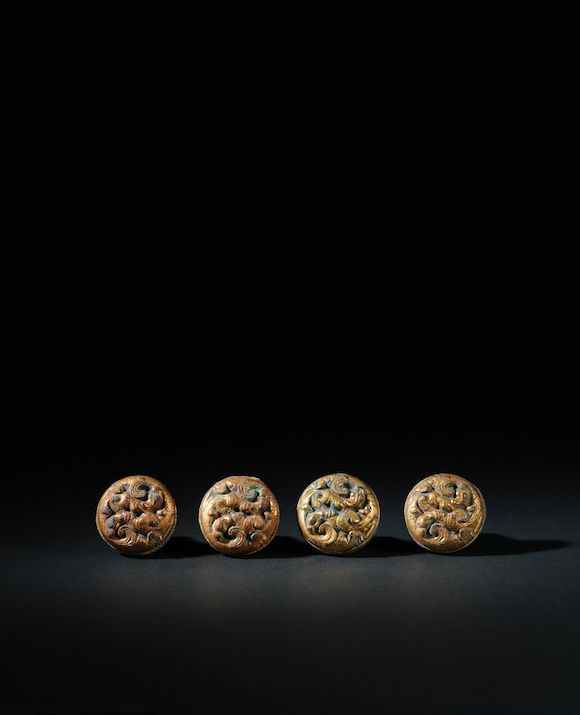 Bonhams : A SET OF FOUR GILT-BRONZE ZITHER STRING ANCHORS Western Han ...