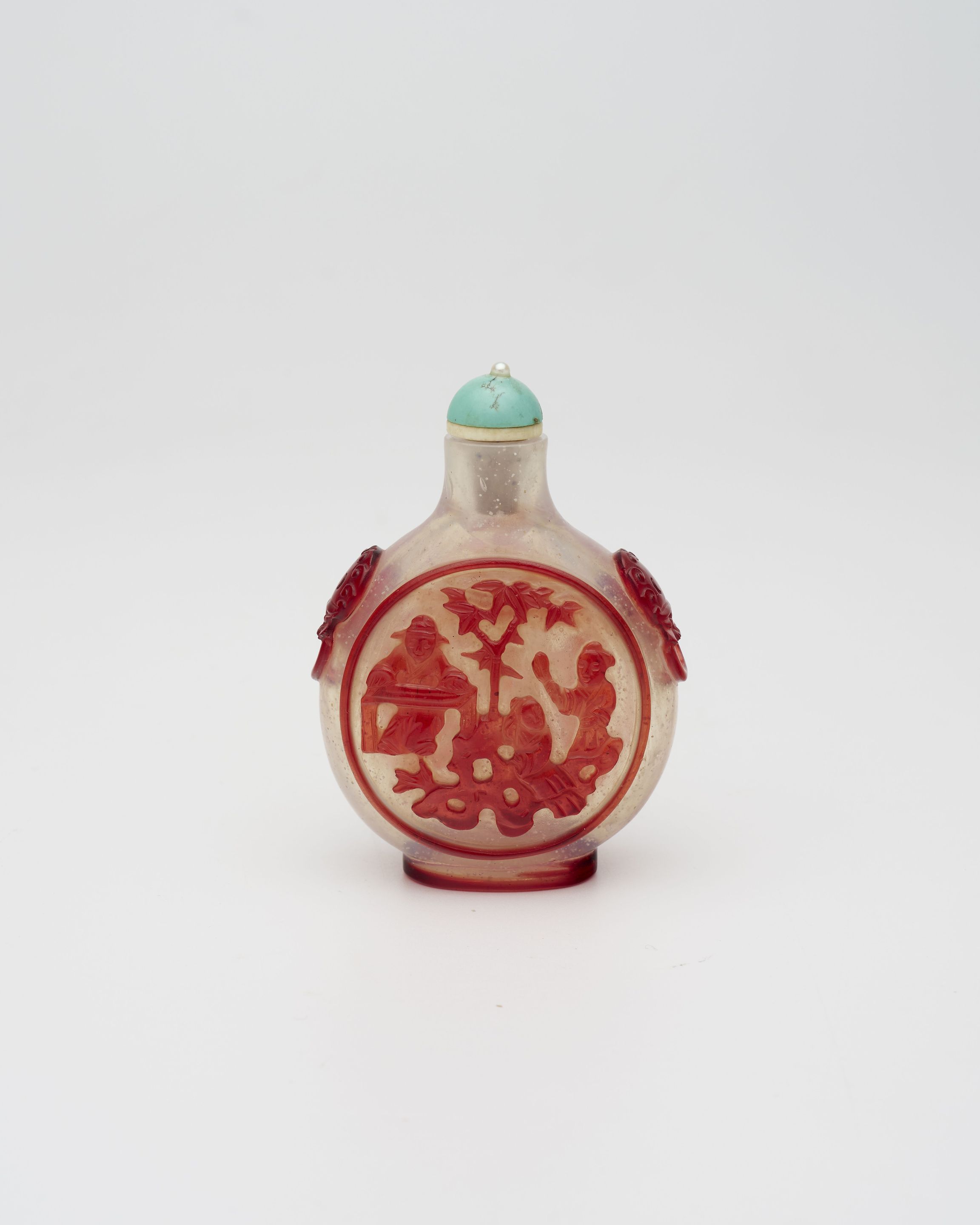 A RED OVERLAY GLASS 'FOLKLORE' SNUFF BOTTLE 19th century