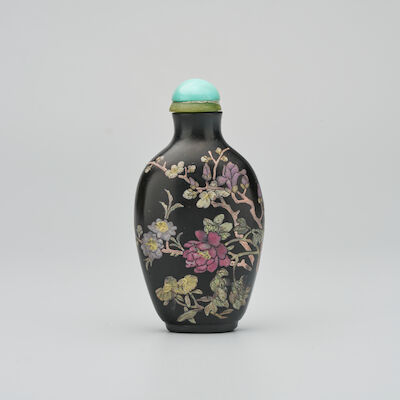 AN ENAMELLED BLACK GLASS 'FLORAL' SNUFF BOTTLE Qianlong four-character seal mark, 1770-1820