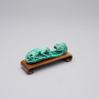 A GREEN-GLAZED 'DRAGON' BELT BUCKLE 19th century
