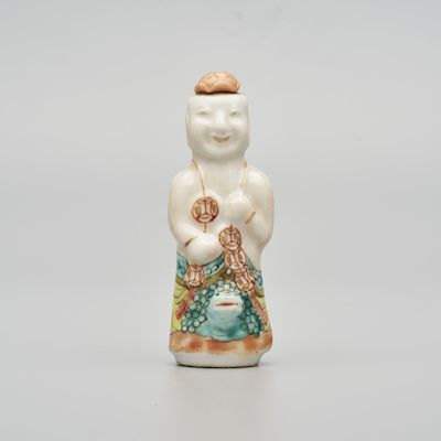 A MOULDED FAMILLE ROSE 'BOY' SNUFF BOTTLE Tongzhi four-character mark, late Qing Dynasty