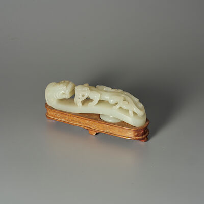 A PALE GREEN JADE 'CHI DRAGON' BELT BUCKLE 19th century