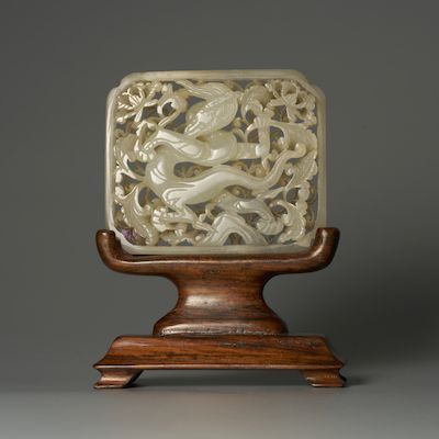 A GREENISH WHITE JADE 'DRAGON' PLAQUE Ming Dynasty, 15th century