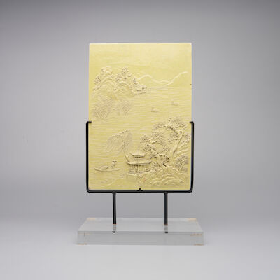 A LIME YELLOW-GLAZED BISCUIT PORCELAIN 'LANDSCAPE' PLAQUE 19th century