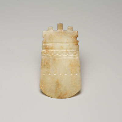 AN ARCHAISTIC RUSSET JADE AXE BLADE, YUE 19th/20th century