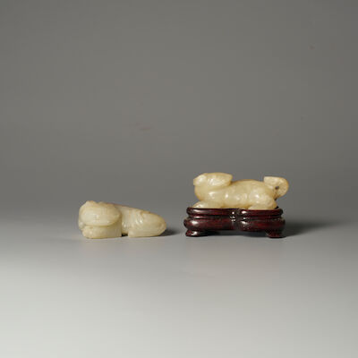 TWO GREENISH WHITE JADE CARVINGS OF A CAT AND A TIANLU 19th/20th century (2)