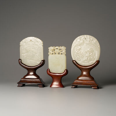 THREE GREENISH WHITE JADE PLAQUES 19th/20th century (3)