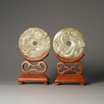 A GREENISH WHITE JADE 'LION AND CUB' AND A GREEN JADE 'CHI DRAGON' PENDANT 19th/20th century (2)