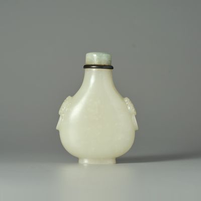 A GREENISH WHITE JADE SNUFF BOTTLE 19th century