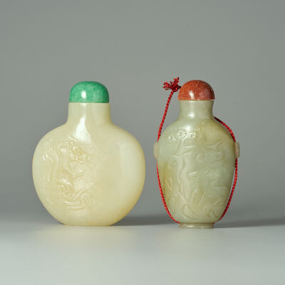 A GREENISH WHITE JADE 'DRAGON' AND A GREEN JADE 'CRANE' SNUFF BOTTLE 19th/20th century (2)