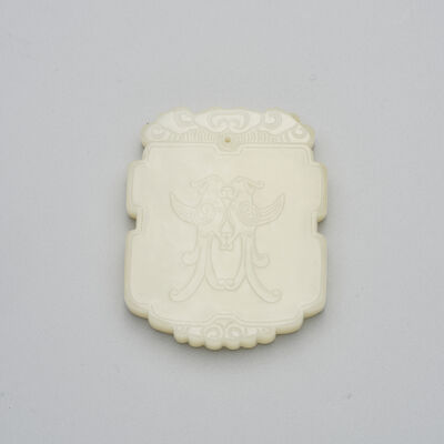 A WHITE JADE 'MANMAN' PLAQUE 19th/20th century