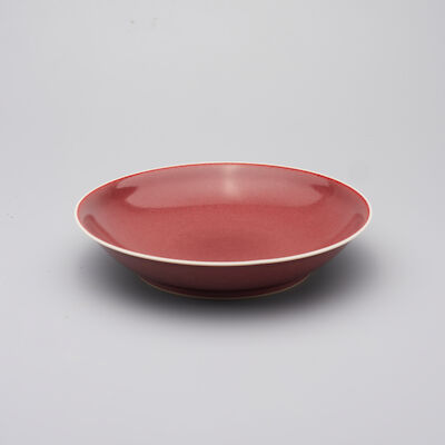 A SANG-DE-BOEUF-GLAZED DISH Qianlong six-character mark, and possibly of the period