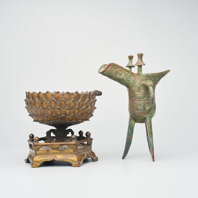 A GILT BRONZE 'LOTUS' STAND AND A BRONZE WINE CUP, JUE The lotus seat, Ming Dynasty (2)