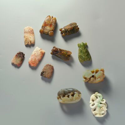 A BLACK AND WHITE JADE 'DOUBLE BADGER', A JADEITE 'GODDESS', A GREEN JADE 'LIONS', AND EIGHT JADE 'CICADA' CARVINGS 20th century (11)