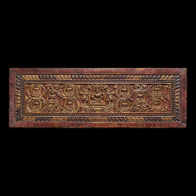 A GILT POLYCHROMED WOOD SUTRA COVER TIBET, 14TH CENTURY
