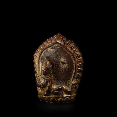 A COPPER ALLOY PLAQUE OF BABY KRISHNA NEPAL, 17TH CENTURY