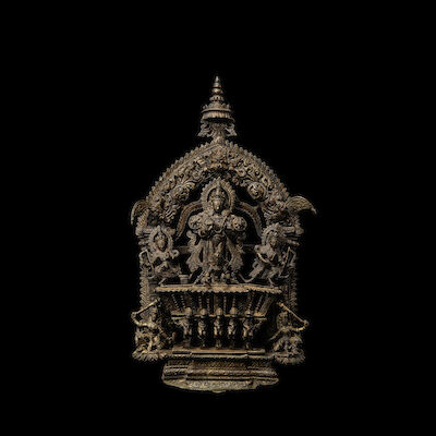 A COPPER ALLOY FIGURE OF SURYA NEPAL, 18TH CENTURY