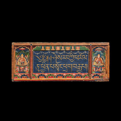 A POLYCHROMED WOOD SUTRA COVER TIBET, 17TH/18TH CENTURY
