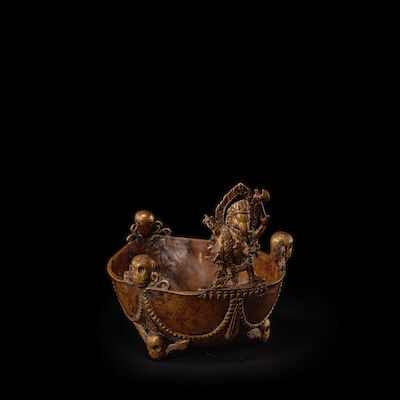 A COPPER ALLOY KAPALA WITH GANESHA NEPAL, 17TH/18TH CENTURY