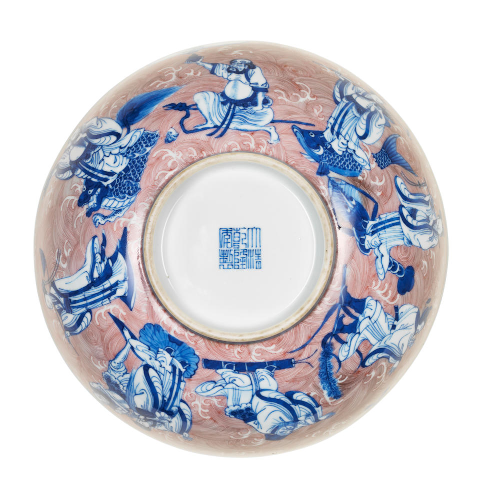 A blue and white and copper-red 'Immortals' bowl Qianlong seal mark and of the period