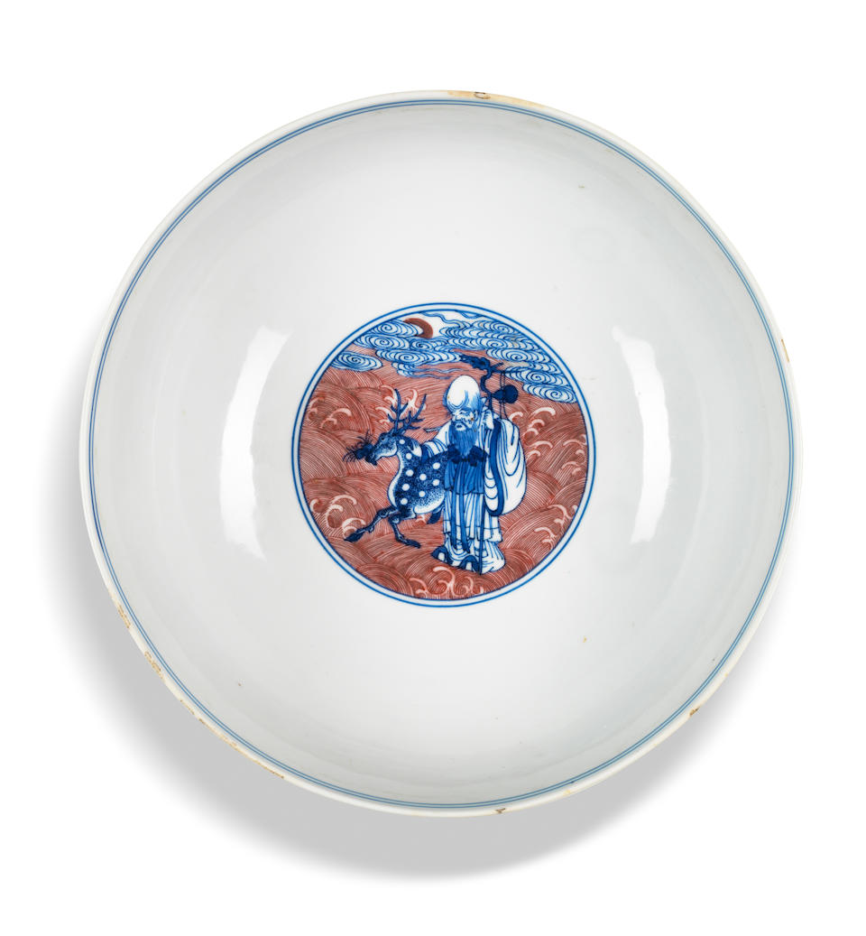 A blue and white and copper-red 'Immortals' bowl Qianlong seal mark and of the period