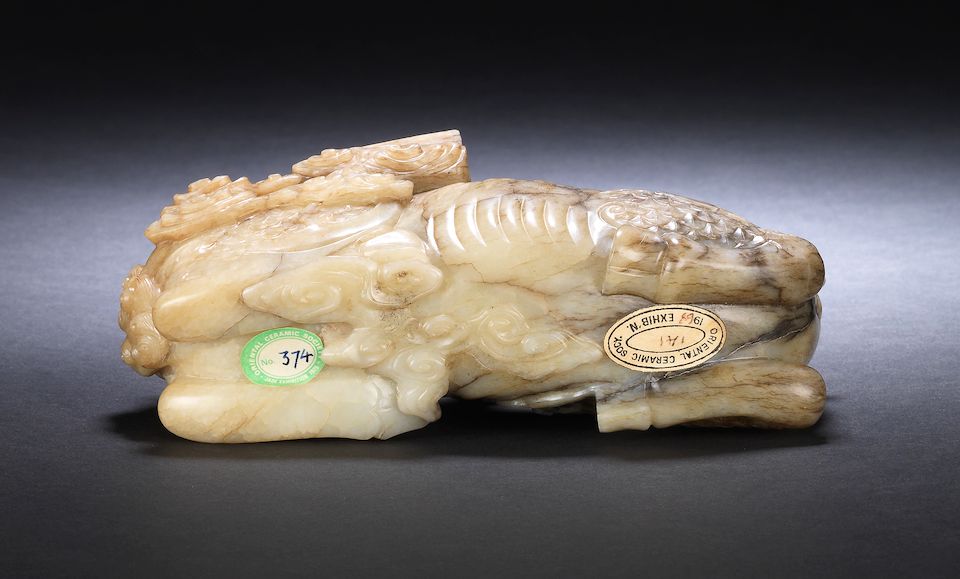 A superb large grey and pale yellow jade carving of a qilin 17th century