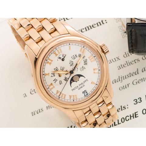 Patek Philippe. A fine and rare 18K rose gold automatic annual calendar moon phase bracelet watch Ref:5036R, Case No.4052248, Movement No.3143373, Circa 2001