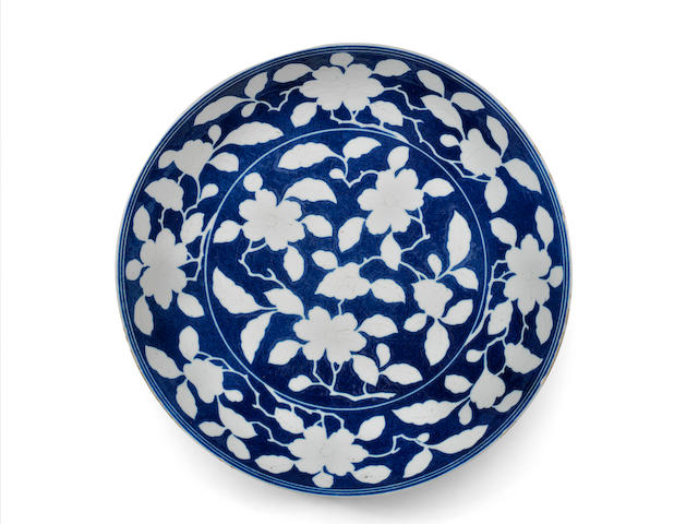 A reserved-decorated blue-ground 'floral' dish Yongzheng six-character mark and of the period