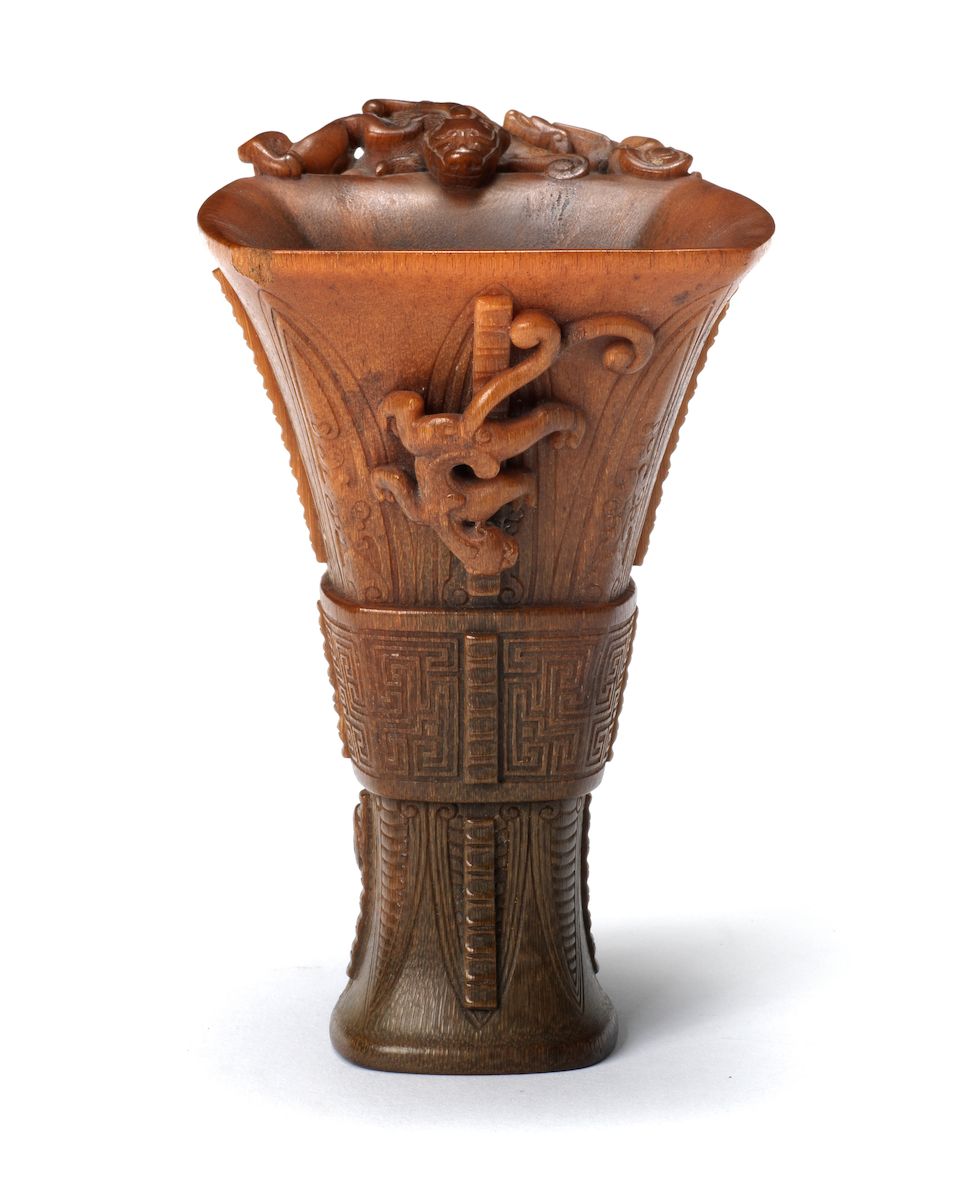A very rare archaistic rhinoceros horn libation cup By Hu Xingyue, incised four-character mark, 17th/18th century