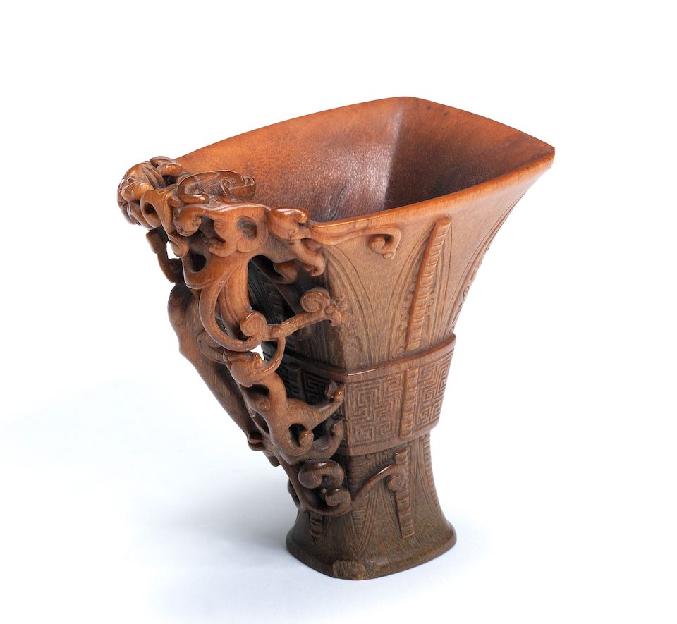 A very rare archaistic rhinoceros horn libation cup By Hu Xingyue, incised four-character mark, 17th/18th century