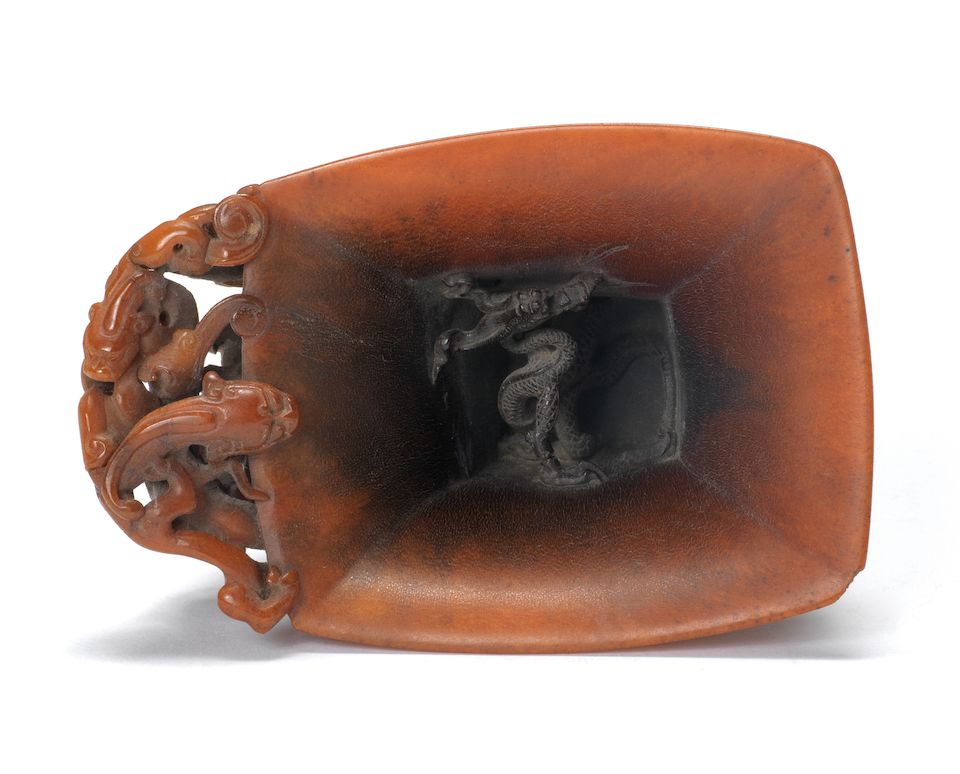 A very rare archaistic rhinoceros horn libation cup By Hu Xingyue, incised four-character mark, 17th/18th century