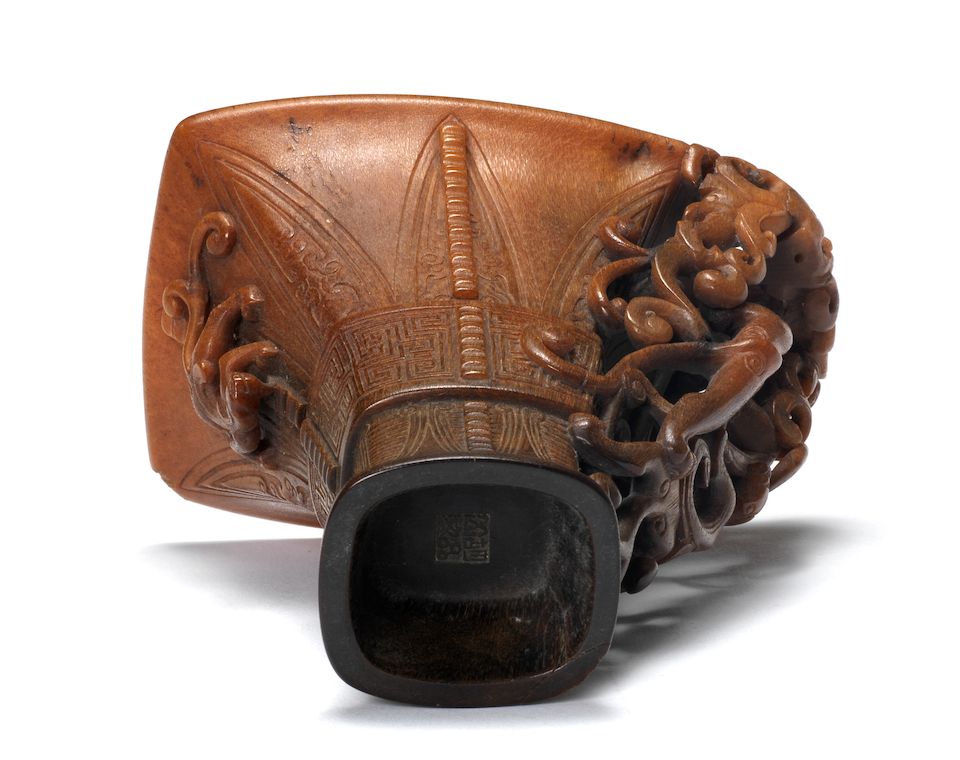 A very rare archaistic rhinoceros horn libation cup By Hu Xingyue, incised four-character mark, 17th/18th century