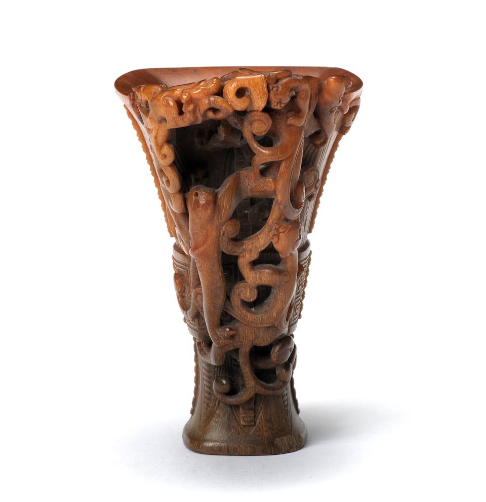 A very rare archaistic rhinoceros horn libation cup By Hu Xingyue, incised four-character mark, 17th/18th century