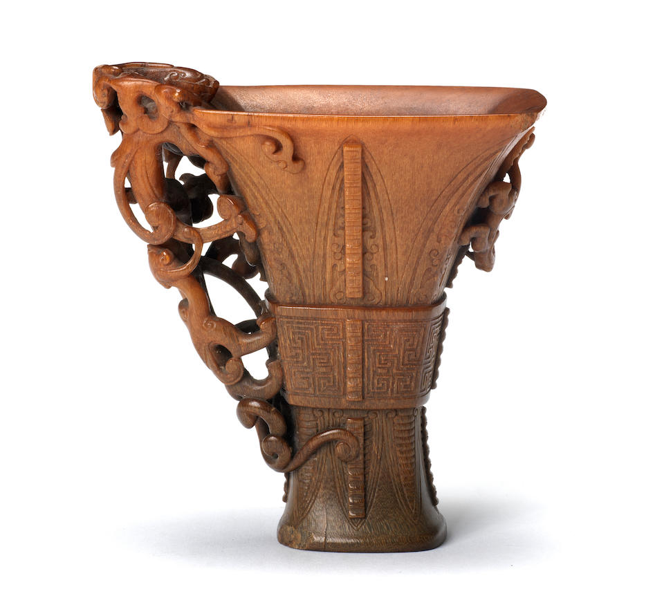 A very rare archaistic rhinoceros horn libation cup By Hu Xingyue, incised four-character mark, 17th/18th century