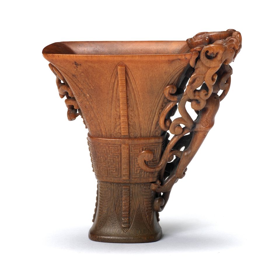 A very rare archaistic rhinoceros horn libation cup By Hu Xingyue, incised four-character mark, 17th/18th century