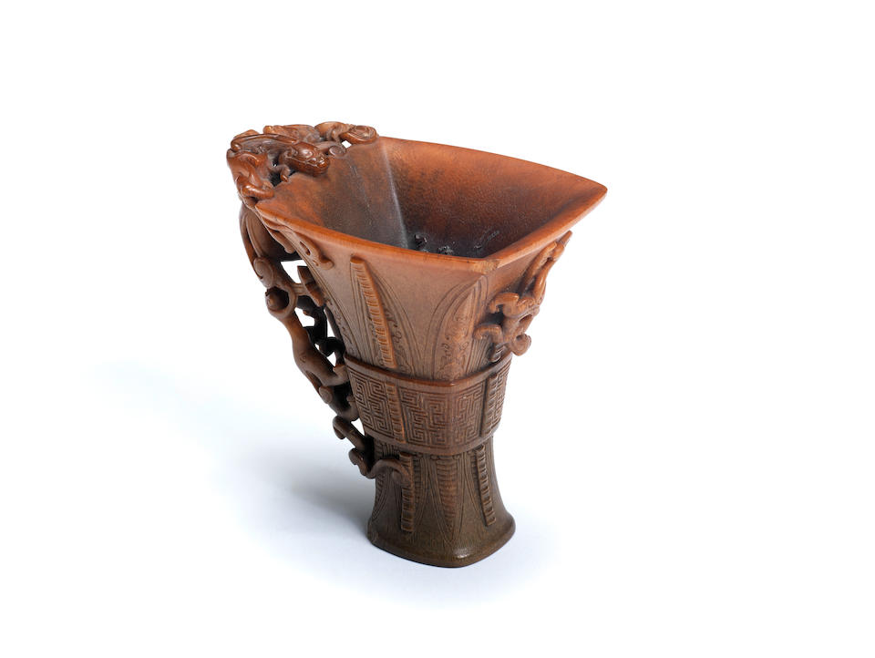 A very rare archaistic rhinoceros horn libation cup By Hu Xingyue, incised four-character mark, 17th/18th century