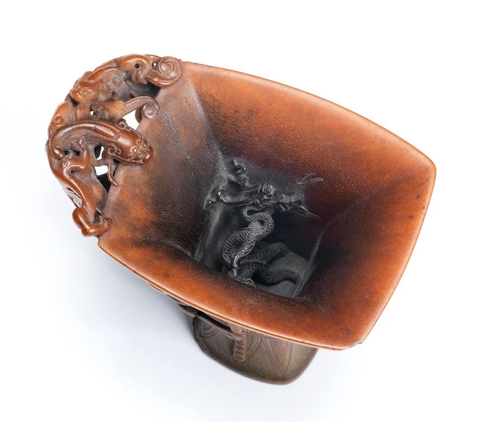 A very rare archaistic rhinoceros horn libation cup By Hu Xingyue, incised four-character mark, 17th/18th century
