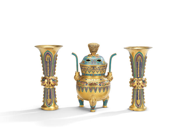 A rare Imperial champlev&#233; and cloisonn&#233; enamel gilt-bronze archaistic three-piece altar set Qianlong (4)