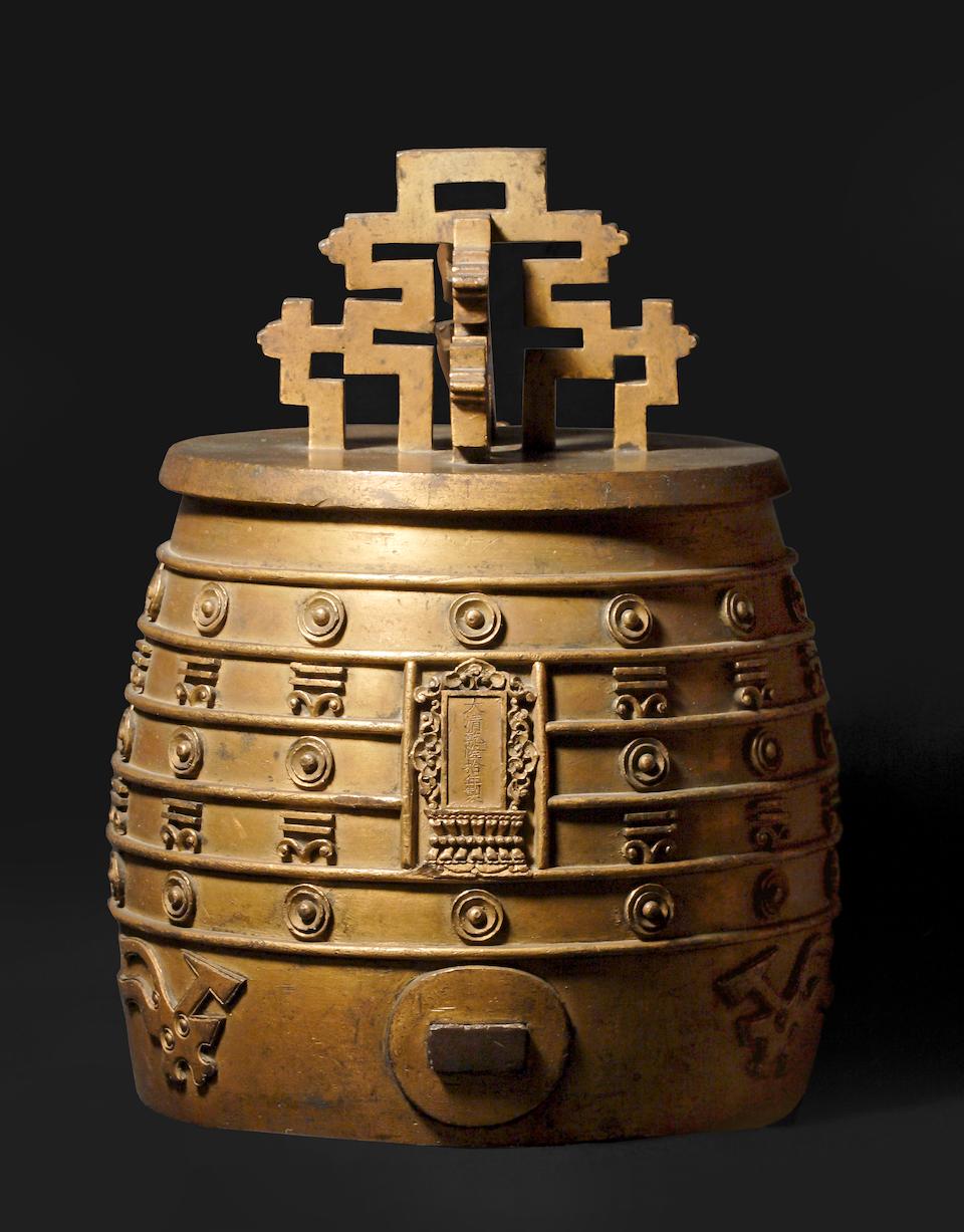 A rare Imperial gilt-bronze archaistic ritual bell, bianzhong Qianlong mark and of the period, dated to the 10th year, corresponding to AD 1745 (2)