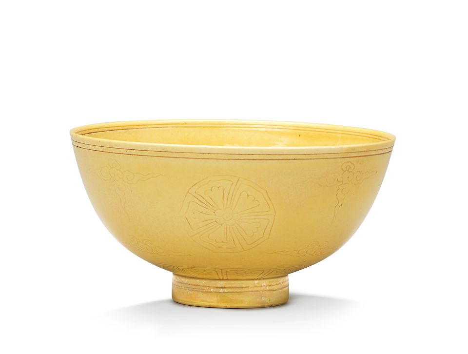 A pair of incised yellow-glazed bowls Kangxi six-character marks and of the period (2)