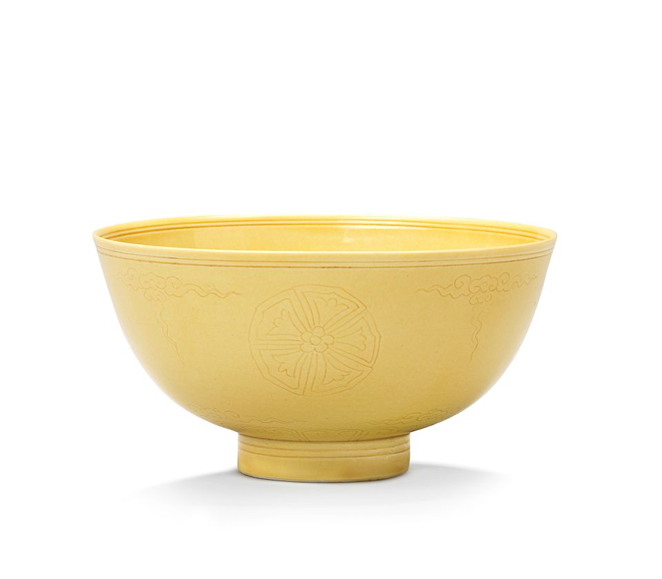 A pair of incised yellow-glazed bowls Kangxi six-character marks and of the period (2)